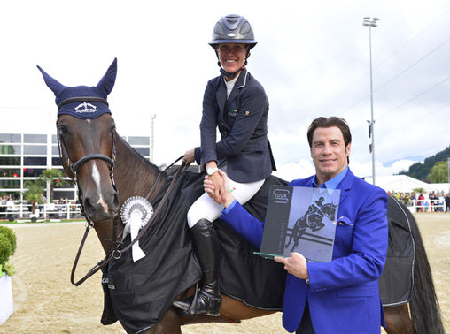 Lauren Hough, short listed for the World Equestrian Games in September, won the CSI5* competition of Saturday evening and was presented with her award by none-other than John Travolta