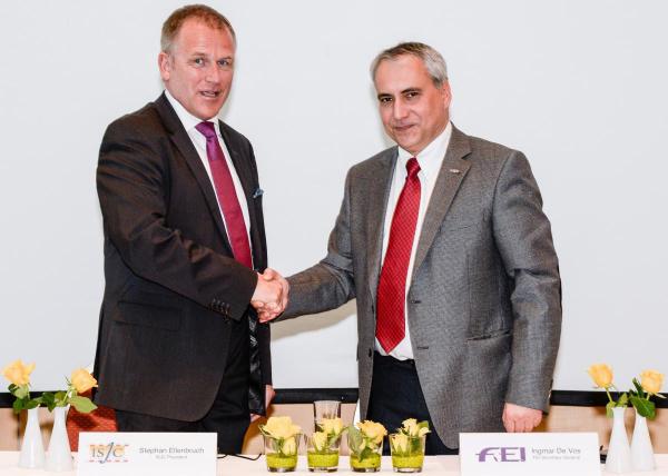  ISJC President Stephan Ellenbruch (left) and FEI Secretary General Ingmar De Vos celebrated the signing of the ISJC’s Memorandum of Understanding with the FEI during an ISJC FEI Refresher Seminar for FEI Judges in Basel (SUI). (Carlo Stuppia/FEI).  