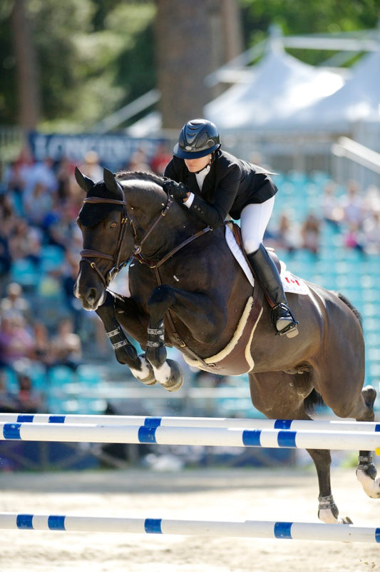 Tiffany Foster and Tripple X III representing Canada at the CSIO5* Piazza di Siena event in Rome, Italy 