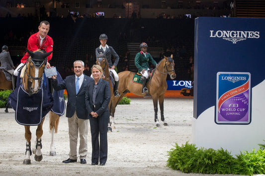 Schwizer Pius (SUI) - Quidam du Vivier at the prize giving with Ingmar de Vos (Secretary General of the FEI) and Silvie Robert (President of the show) Longines FEI World Cup™ Jumping Final 2013/2014 Lyon 2014 © Dirk Caremans