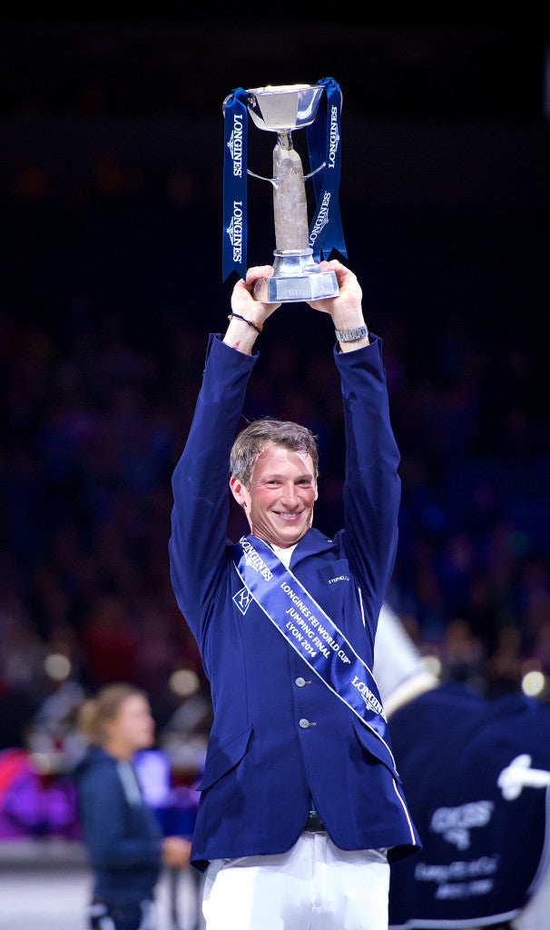 Germany's Daniel Deusser holds the Longines FEI World Cupª aloft after victory in today's final with Cornet D'Amour. Credit: FEI/Arnd Bronkhorst/Pool Pic